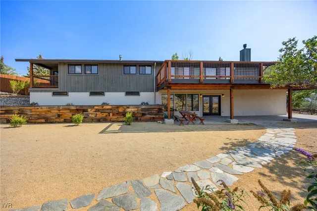 a view of a room with a sink and wooden floor