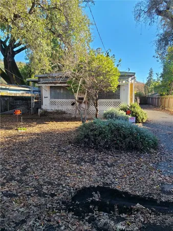 a view of a house with swimming pool and a yard