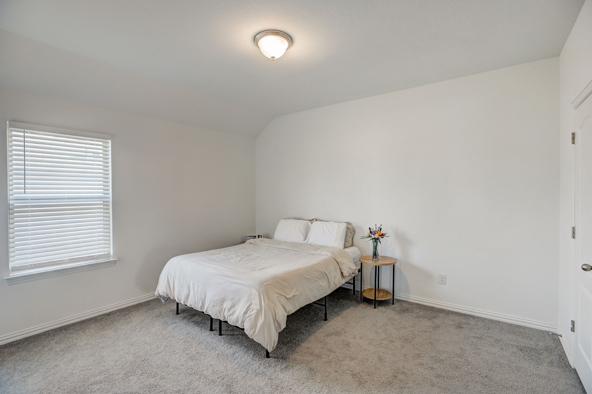 308 Monteforte Road Hutto, TX 78634 - Photo 24 of 32 a bedroom with a bed and a window
