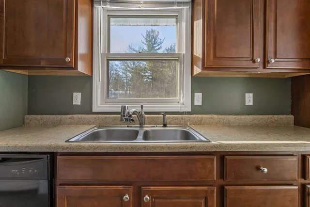 a kitchen with a sink and cabinets