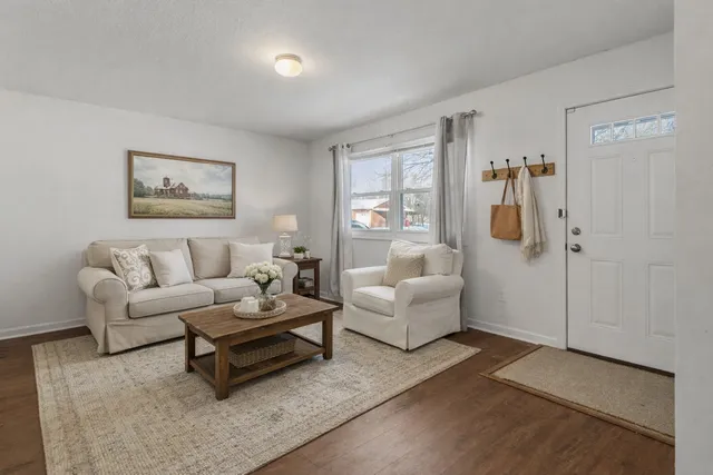 a living room with furniture and a rug