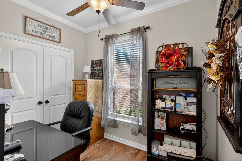 701 West Lamberth Road Sherman, TX 75092 - Photo 29 of 37 Interior space featuring wood-finish flooring and light-toned wall paint
