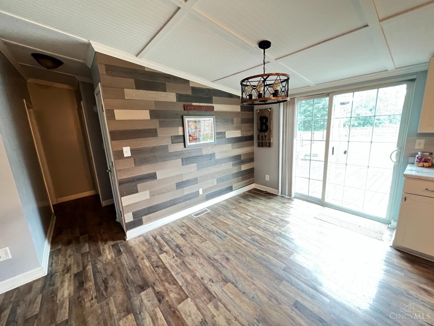 17153 Malady Road Mount Orab, OH 45154 - Photo 11 of 14 Beautiful dining area with custom accent wall and walkout to the backyard area where you can enjoy the fenced yard and hot tub.