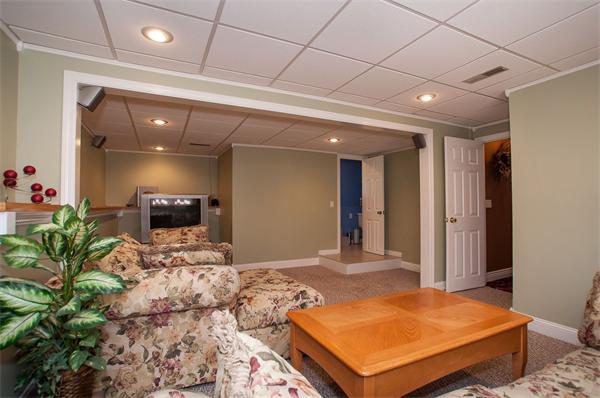 227 West Meadow Road Lowell, MA 01854 - Photo 16 of 25 a bedroom with a bed and a potted plant