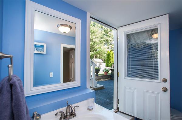 227 West Meadow Road Lowell, MA 01854 - Photo 18 of 25 a bathroom with a sink and a mirror