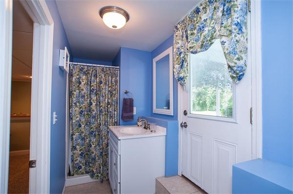 227 West Meadow Road Lowell, MA 01854 - Photo 19 of 25 a bathroom with a sink and a mirror