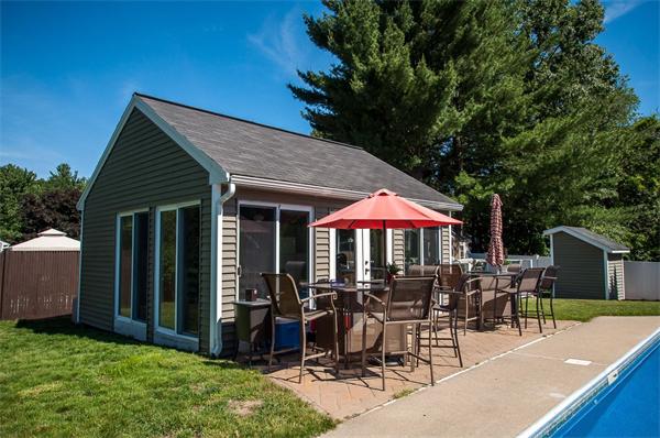 227 West Meadow Road Lowell, MA 01854 - Photo 23 of 25 a view of the patio with table and chairs under an umbrella