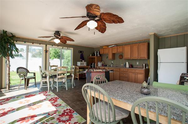 227 West Meadow Road Lowell, MA 01854 - Photo 24 of 25 a kitchen with stainless steel appliances granite countertop a sink a stove and a dining table