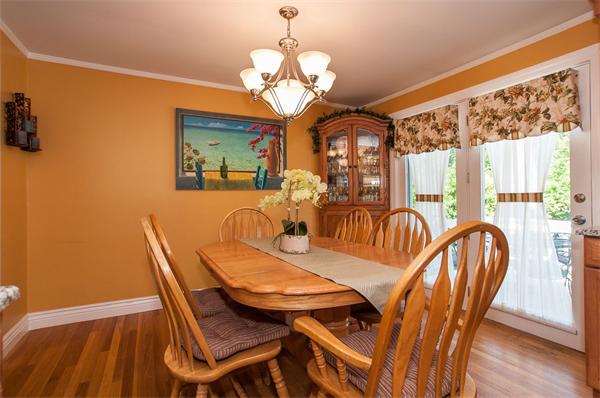 227 West Meadow Road Lowell, MA 01854 - Photo 4 of 25 a view of a dining room with furniture wooden floor and chandelier