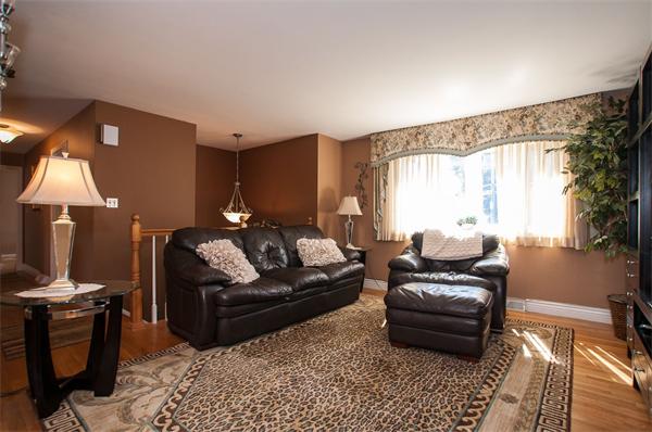 227 West Meadow Road Lowell, MA 01854 - Photo 9 of 25 a living room with furniture fireplace and a flat screen tv