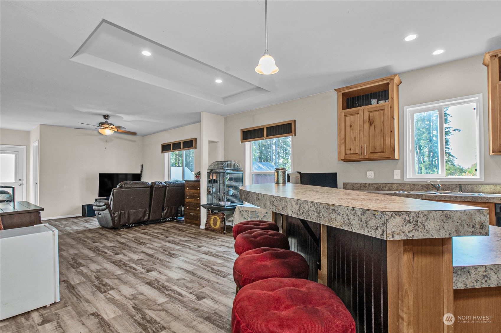 446-67 Meier Road Winlock, WA 98596 - Photo 11 of 33 a living room with furniture a flat screen tv and kitchen view