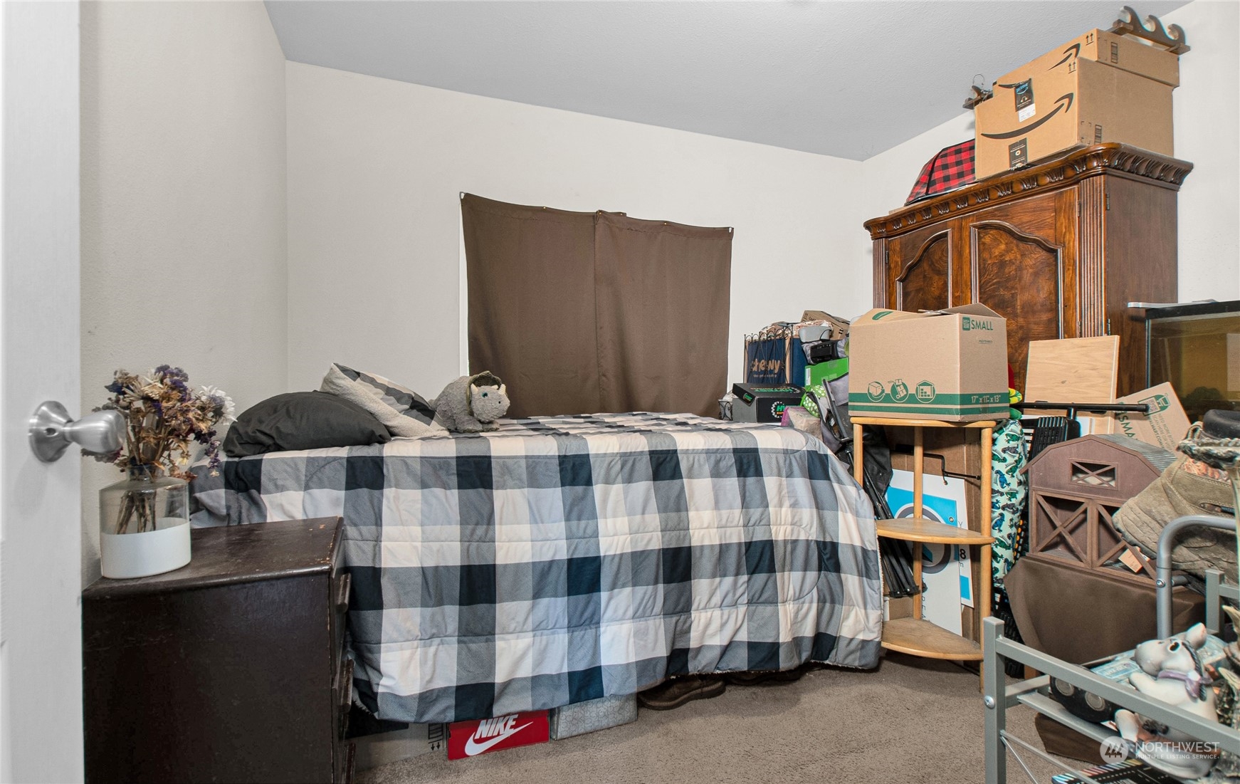 446-67 Meier Road Winlock, WA 98596 - Photo 18 of 33 a bedroom with a bed and wooden floor