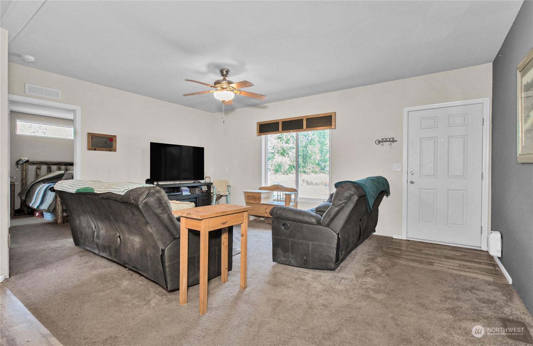 446-67 Meier Road Winlock, WA 98596 - Photo 2 of 33 a living room with furniture and a flat screen tv