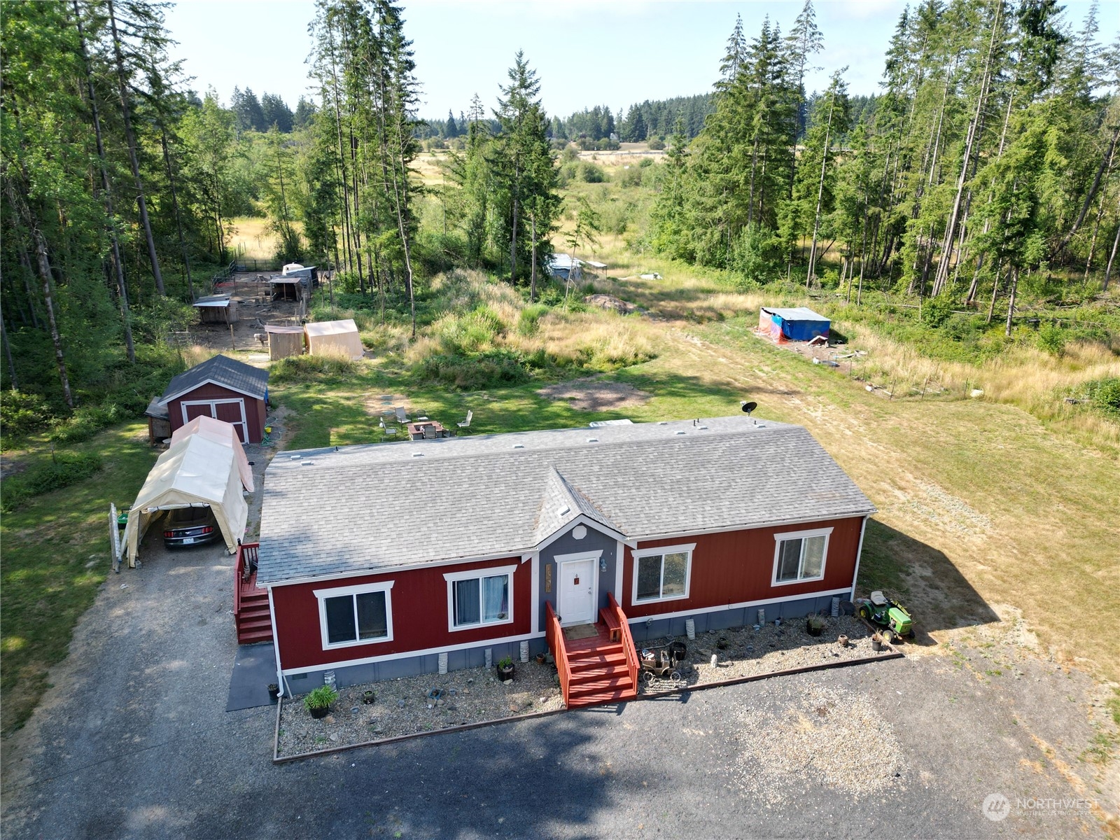 446-67 Meier Road Winlock, WA 98596 - Photo 24 of 33 an aerial view of a house with a yard and lake view