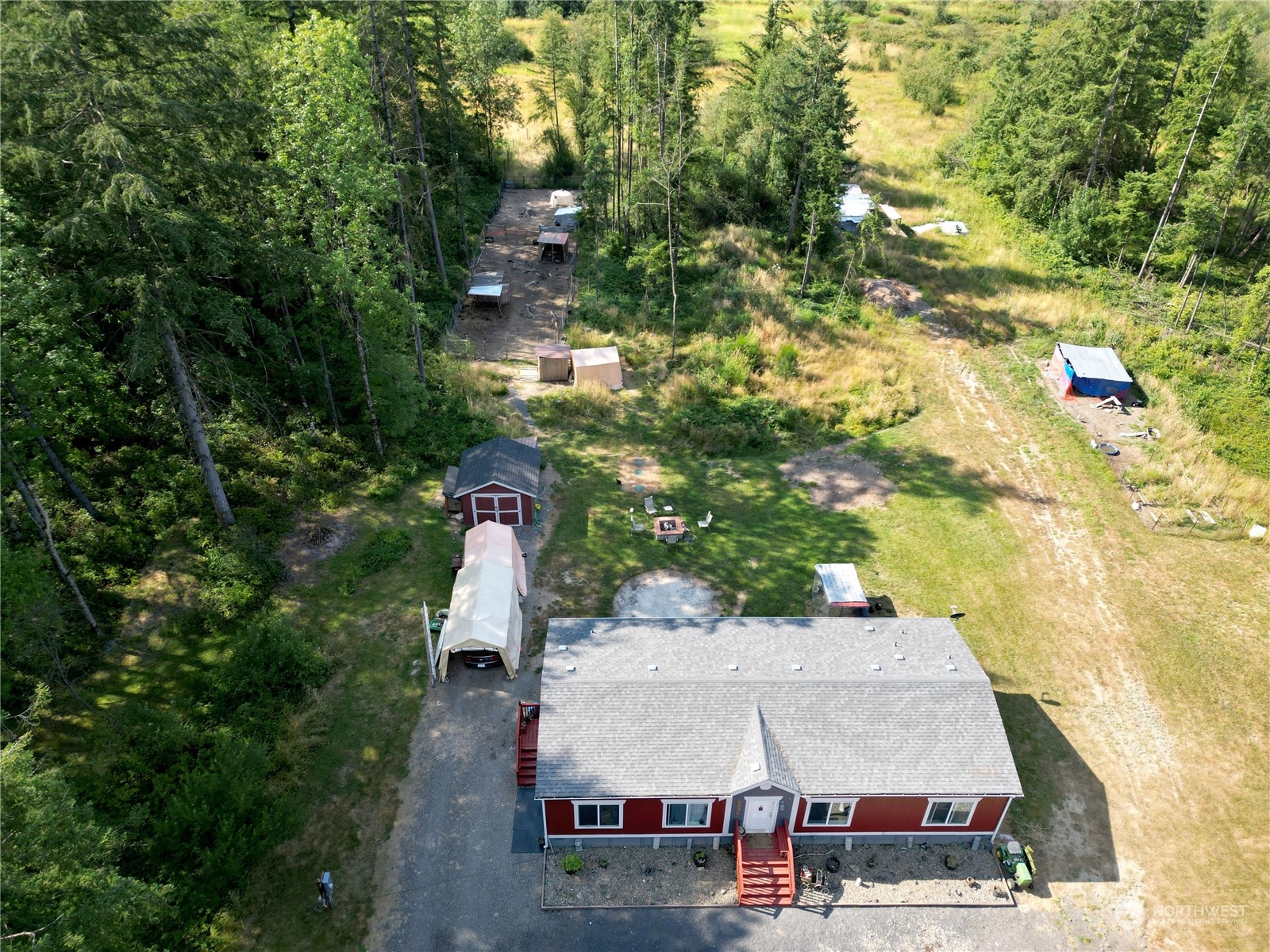 446-67 Meier Road Winlock, WA 98596 - Photo 27 of 33 an aerial view of a house with swimming pool and large trees
