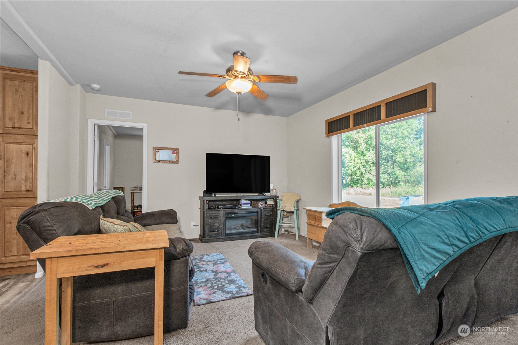 446-67 Meier Road Winlock, WA 98596 - Photo 3 of 33 a living room with furniture a flat screen tv and a window