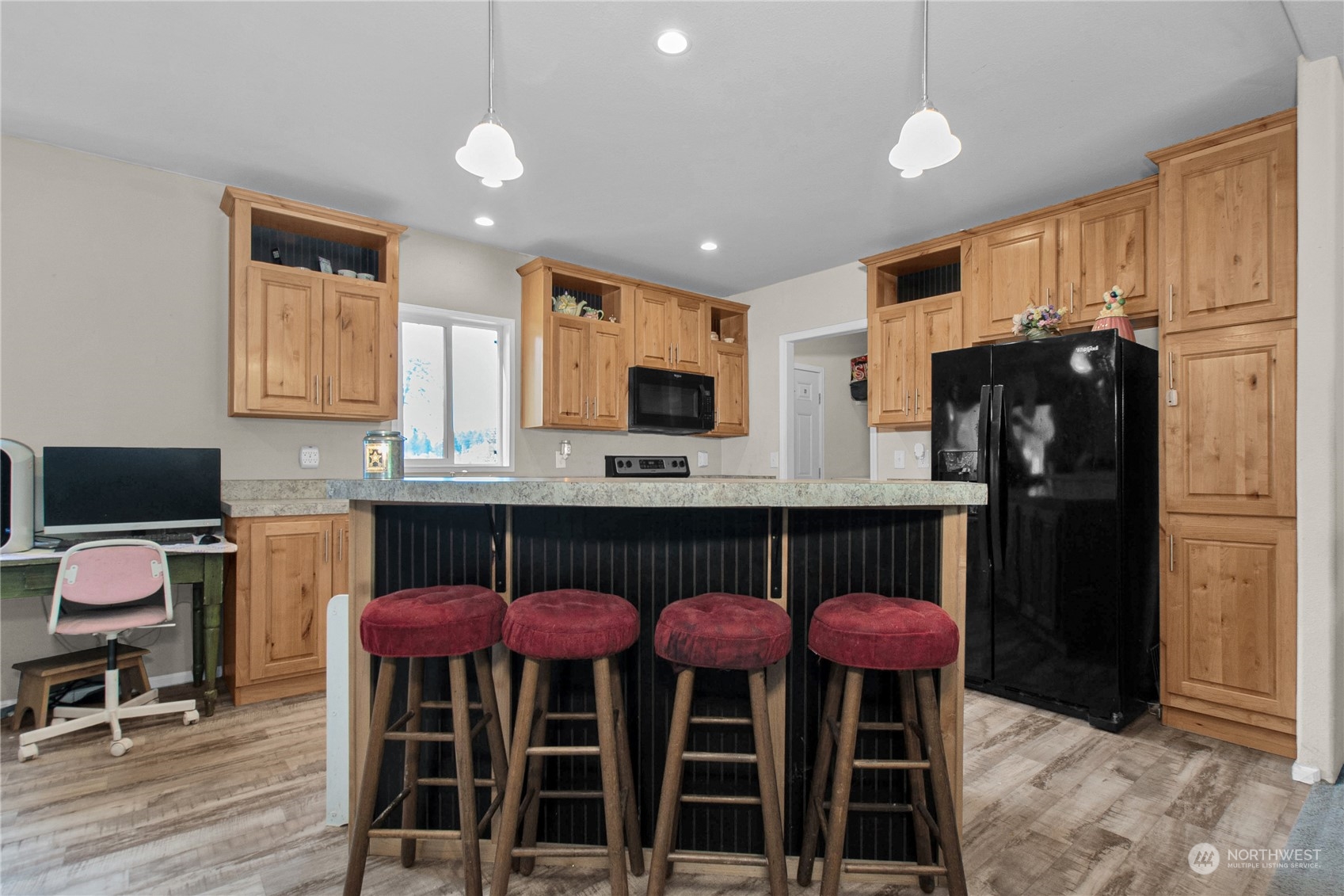 446-67 Meier Road Winlock, WA 98596 - Photo 7 of 33 a kitchen with stainless steel appliances a dining table chairs refrigerator and sink