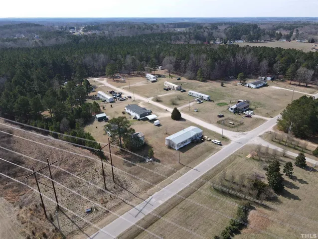 a view of a terrace with a table and chairs
