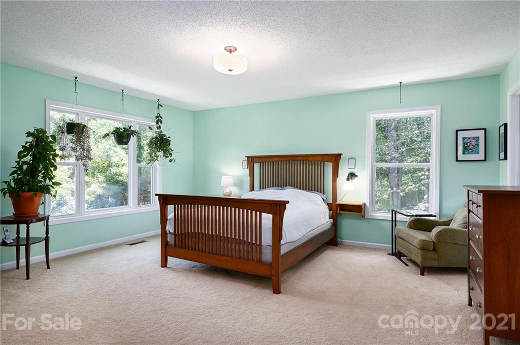 1747 Secluded Valley Road Marshall, NC 28753 - Photo 14 of 33 a bed room with a bed and a chair