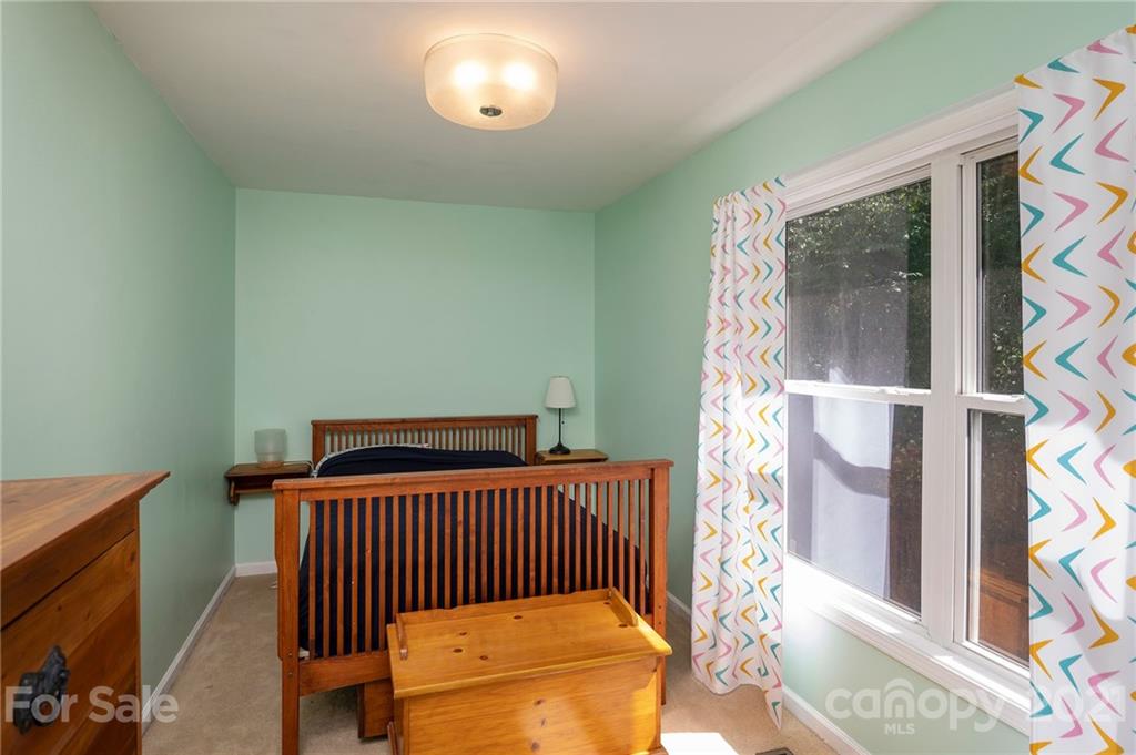 1747 Secluded Valley Road Marshall, NC 28753 - Photo 17 of 33 a bedroom with a bed and a window