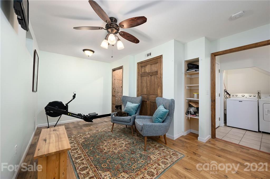 1747 Secluded Valley Road Marshall, NC 28753 - Photo 18 of 33 a living room with furniture and a rug