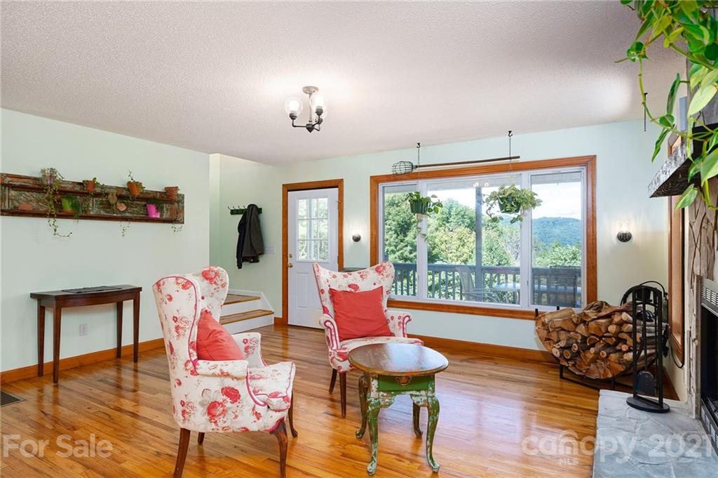 1747 Secluded Valley Road Marshall, NC 28753 - Photo 4 of 33 a living room with furniture and a large window