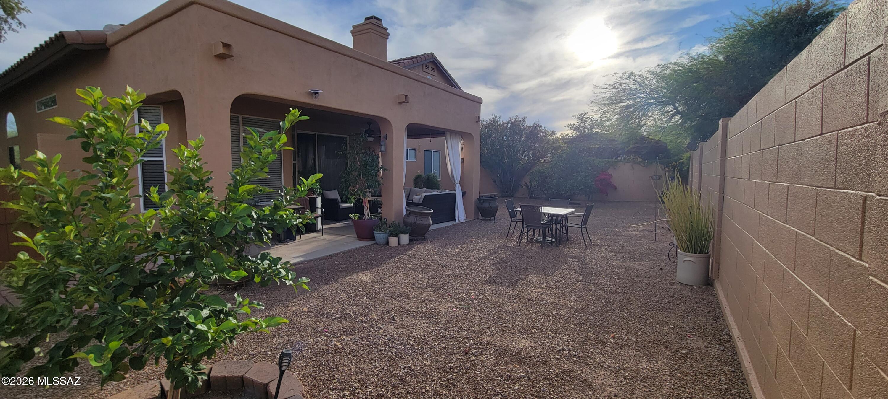 3130 West Star Ranch Trail Tucson, AZ 85742 - Photo 37 of 44 a view of a house with lots of plants and a pathway