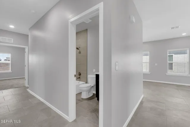 wooden floor in a gallery with a bathroom