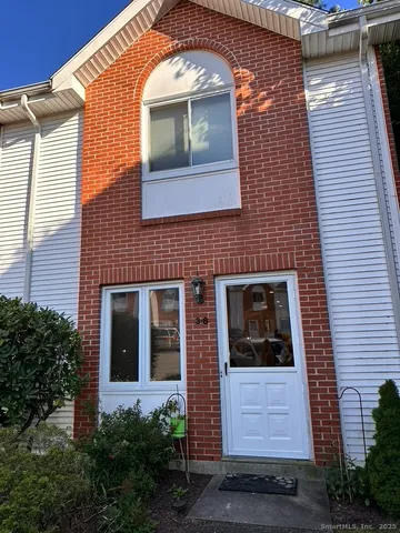 a front view of a house with a large windows