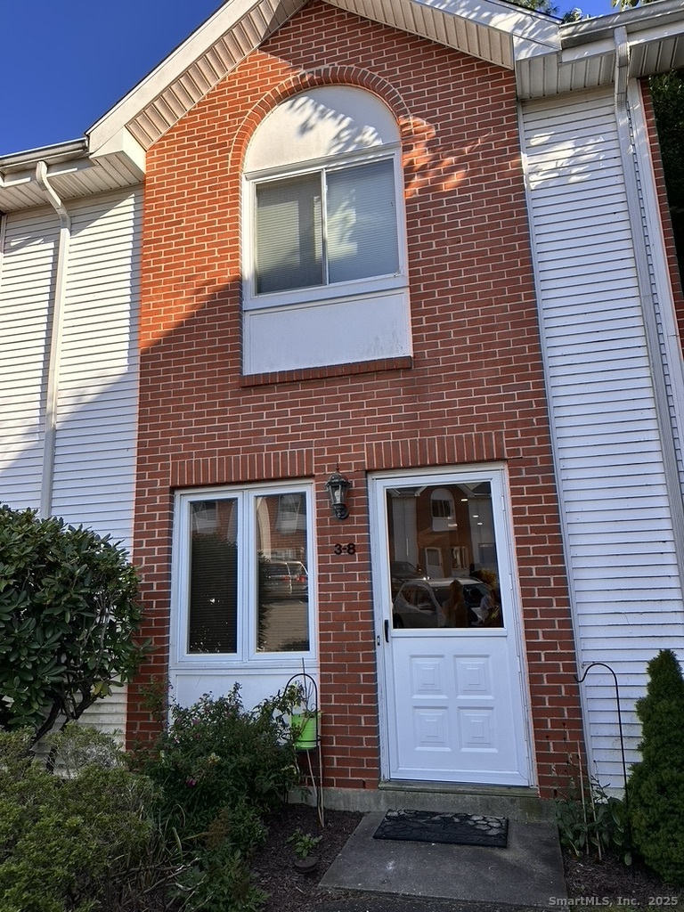 a front view of a house with a large windows
