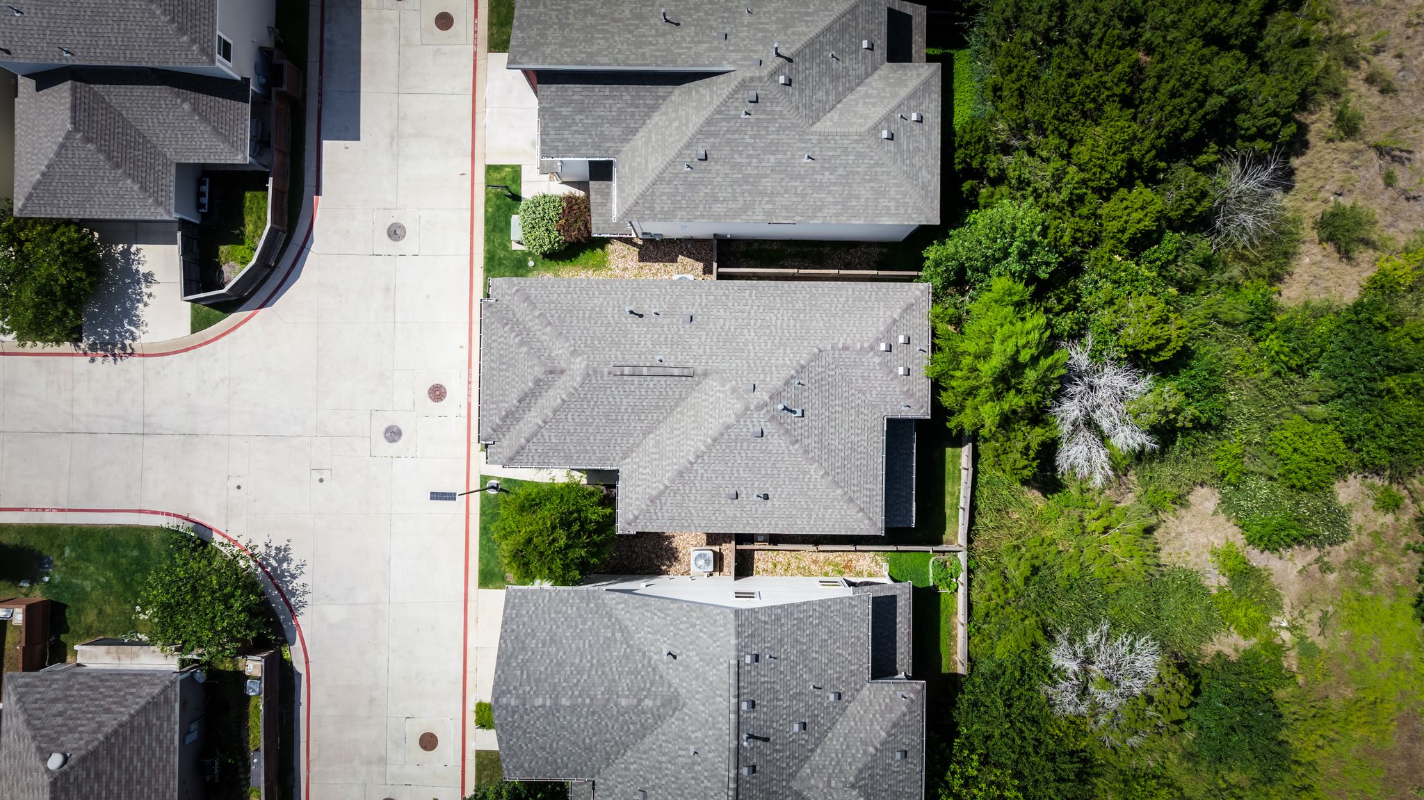 5105 Lemon Tree Path Austin, TX 78723 - Photo 33 of 37 An aerial perspective reveals the residential layout, bordered by verdant natural landscaping.