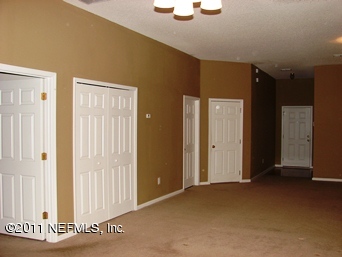 10645 Spring View Road Jacksonville, FL 32221 - Photo 3 of 10 a view of a livingroom with wooden floor