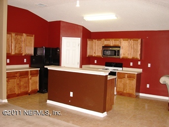 10645 Spring View Road Jacksonville, FL 32221 - Photo 5 of 10 a kitchen with stainless steel appliances a microwave and a refrigerator