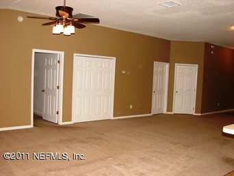 10645 Spring View Road Jacksonville, FL 32221 - Photo 6 of 10 a view of a livingroom with a chandelier fan