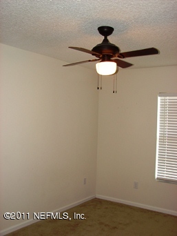 10645 Spring View Road Jacksonville, FL 32221 - Photo 8 of 10 a close view of a chandelier in a bathroom