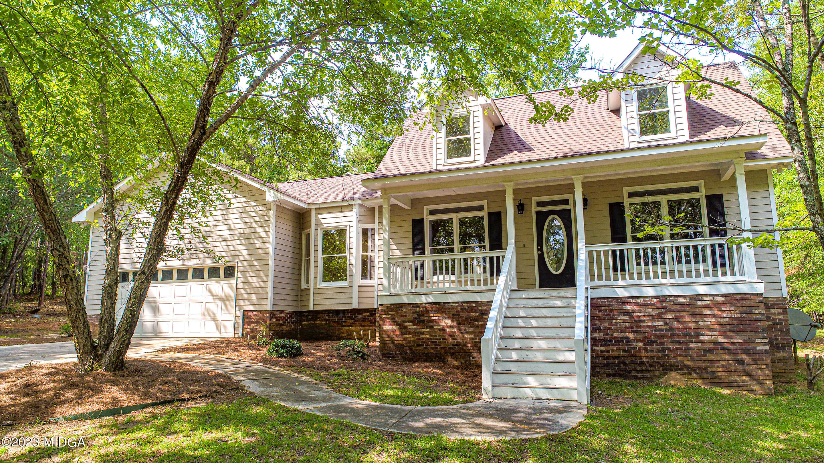 front view of a house with a yard