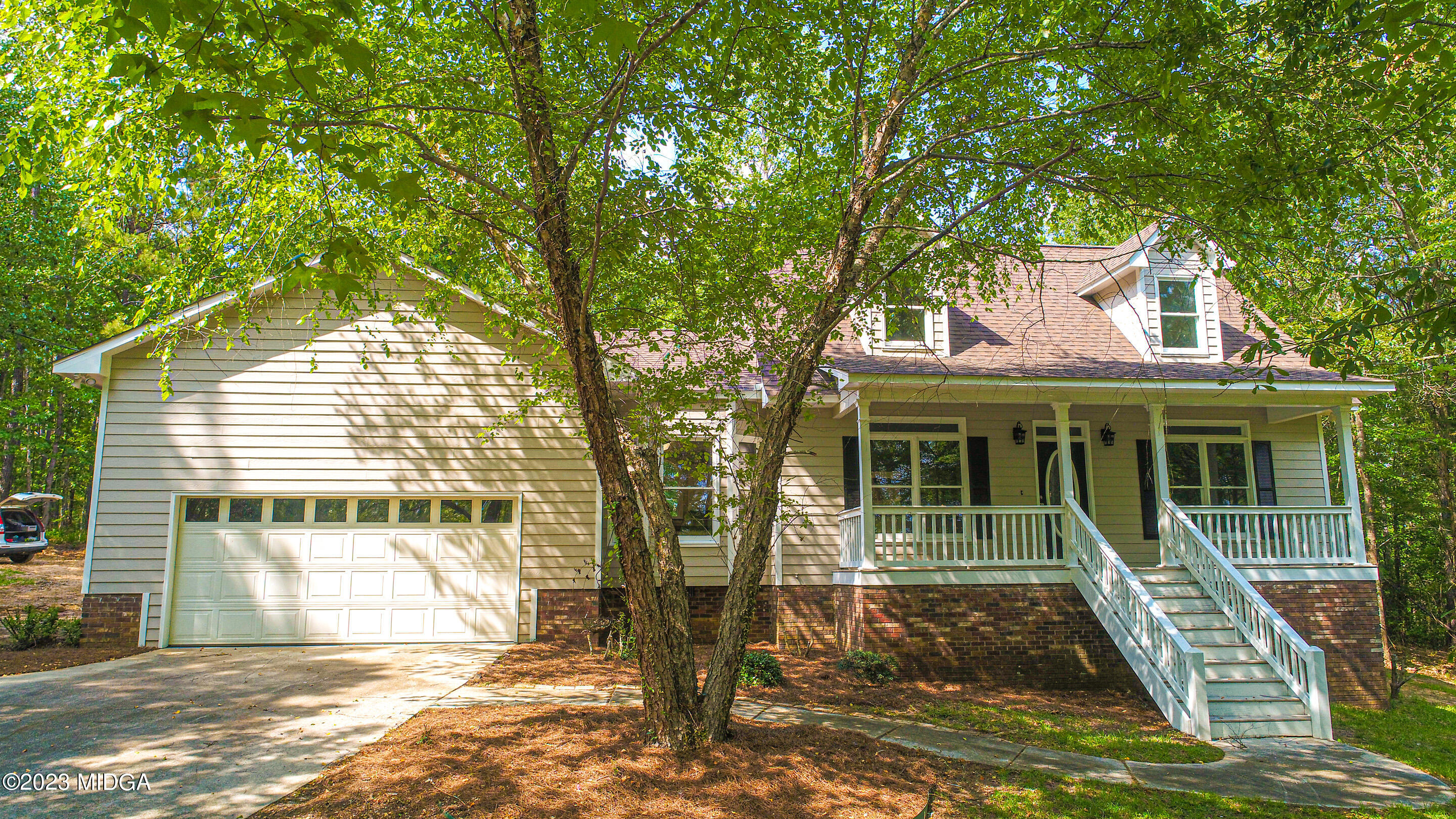 2818 Pea Ridge Road Juliette, GA 31046 - Photo 15 of 71 a front view of a house with a yard