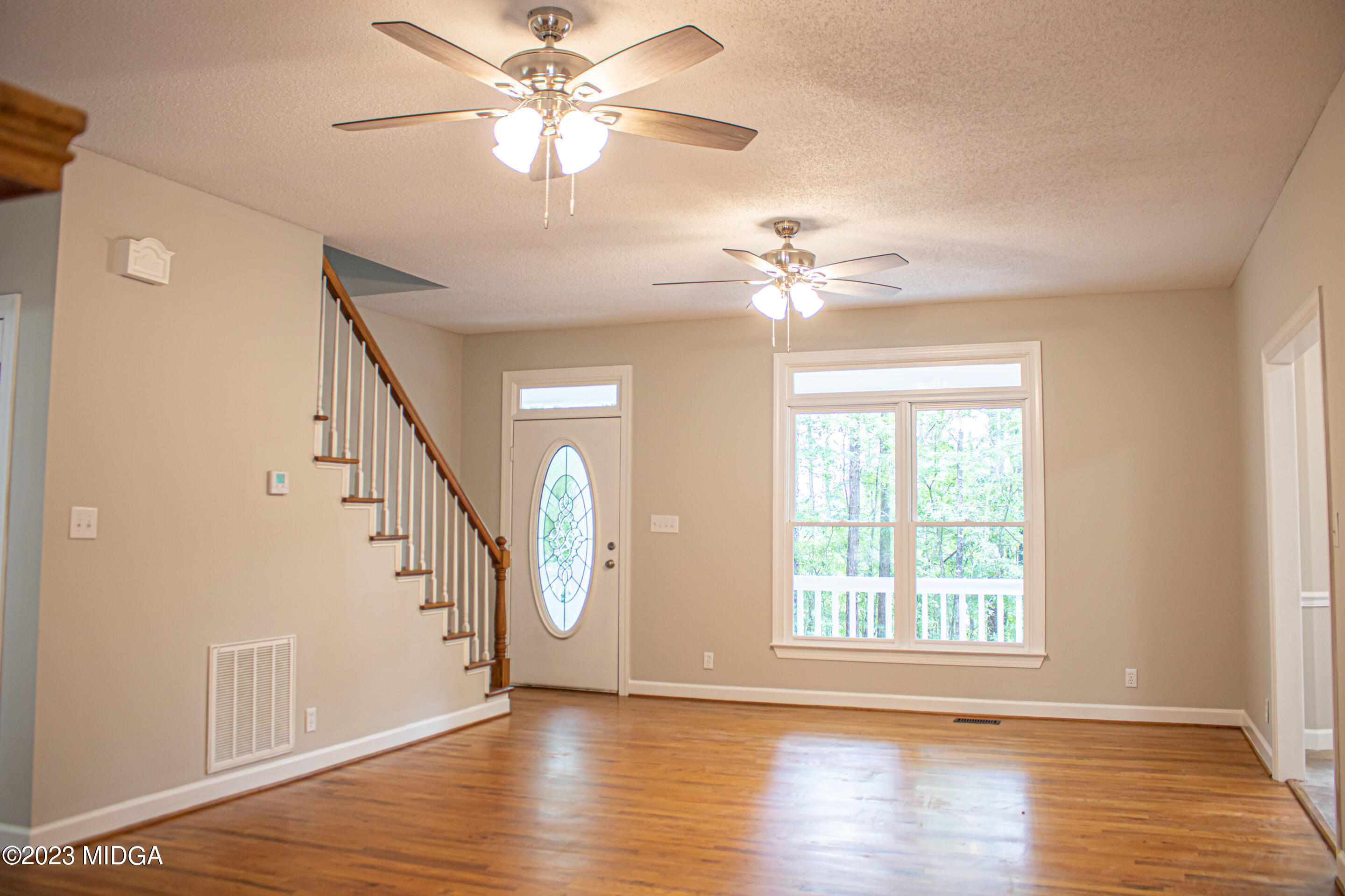2818 Pea Ridge Road Juliette, GA 31046 - Photo 17 of 71 a view of an empty room with wooden floor and a window