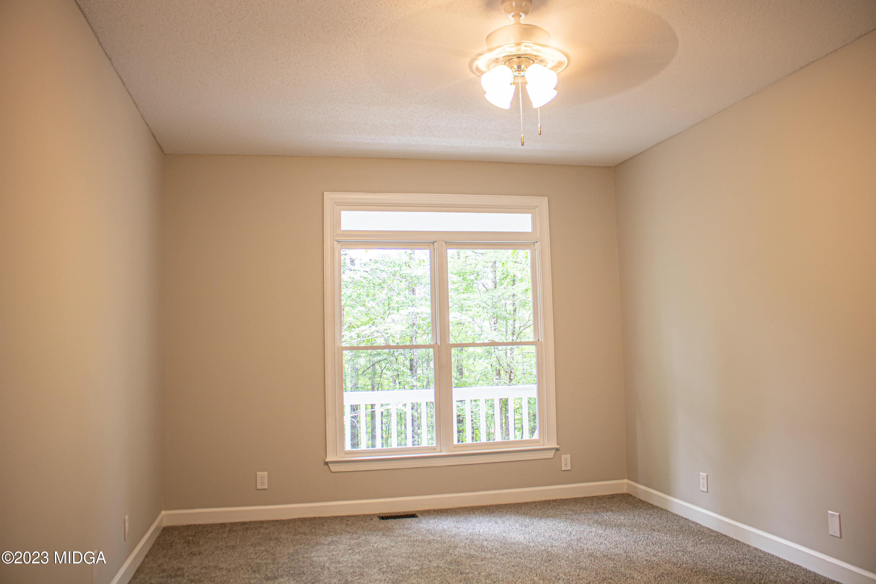 2818 Pea Ridge Road Juliette, GA 31046 - Photo 33 of 71 an empty room with a window
