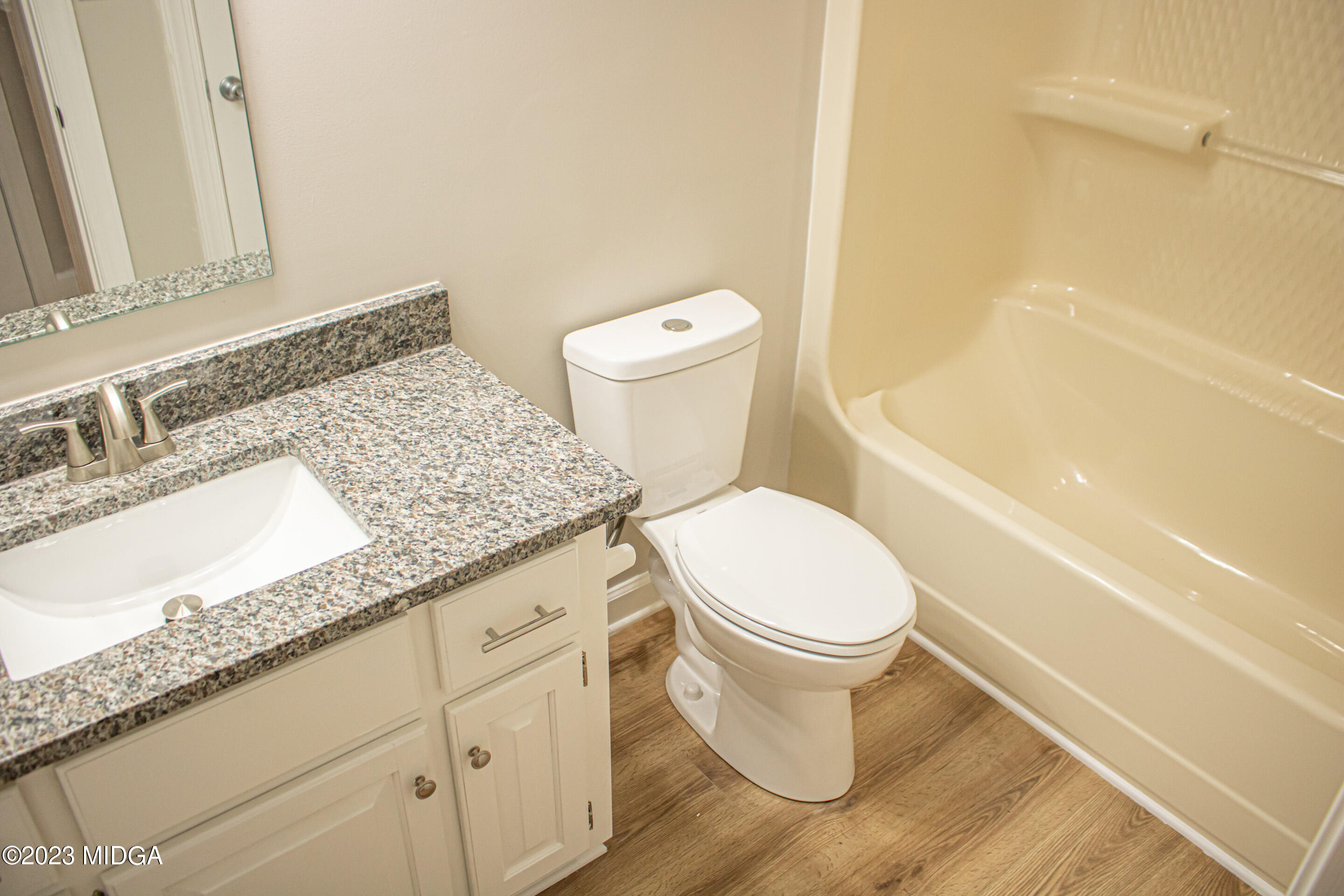 2818 Pea Ridge Road Juliette, GA 31046 - Photo 35 of 71 a white toilet sitting next to a bath tub