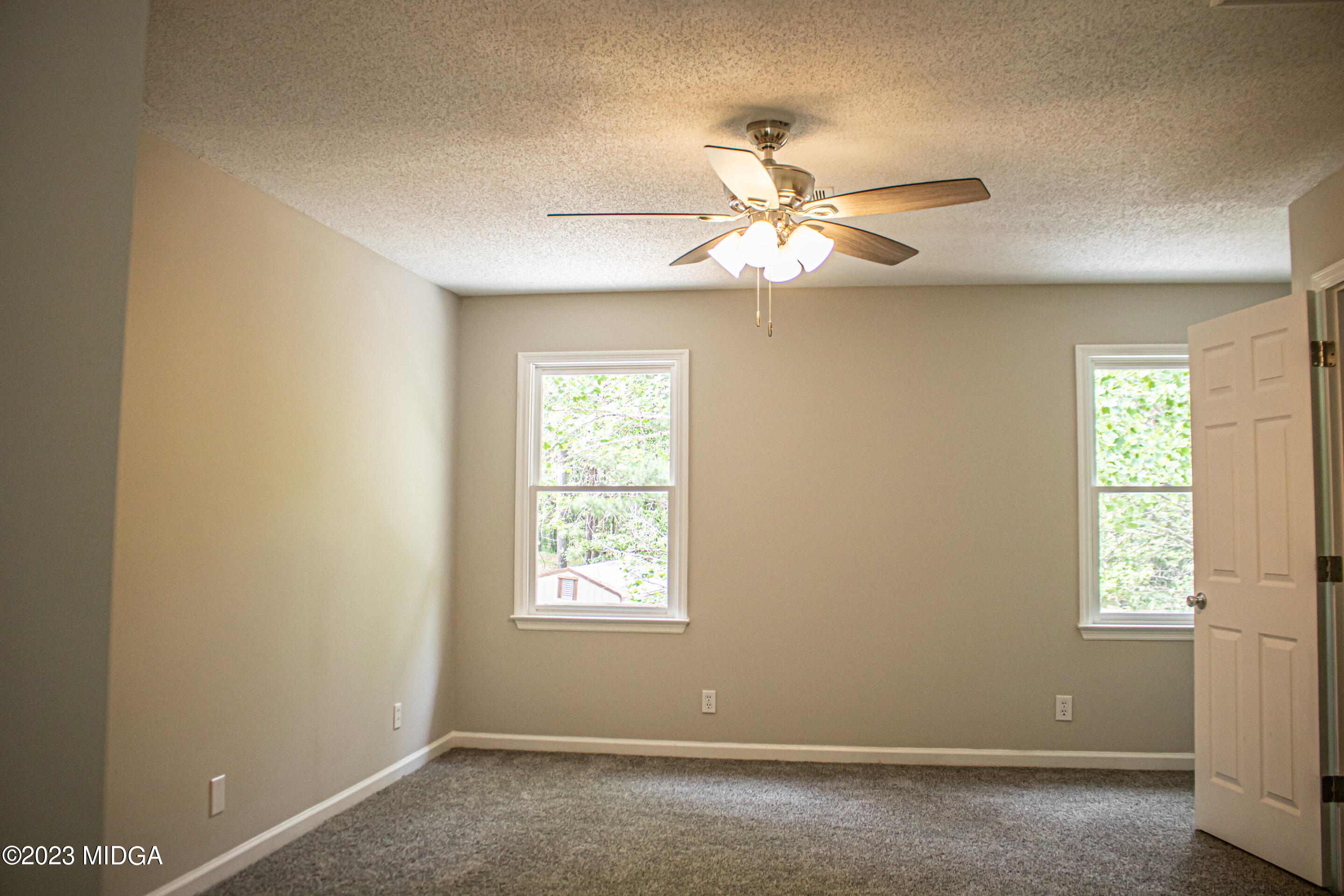 2818 Pea Ridge Road Juliette, GA 31046 - Photo 38 of 71 a view of a room with a ceiling fan and window