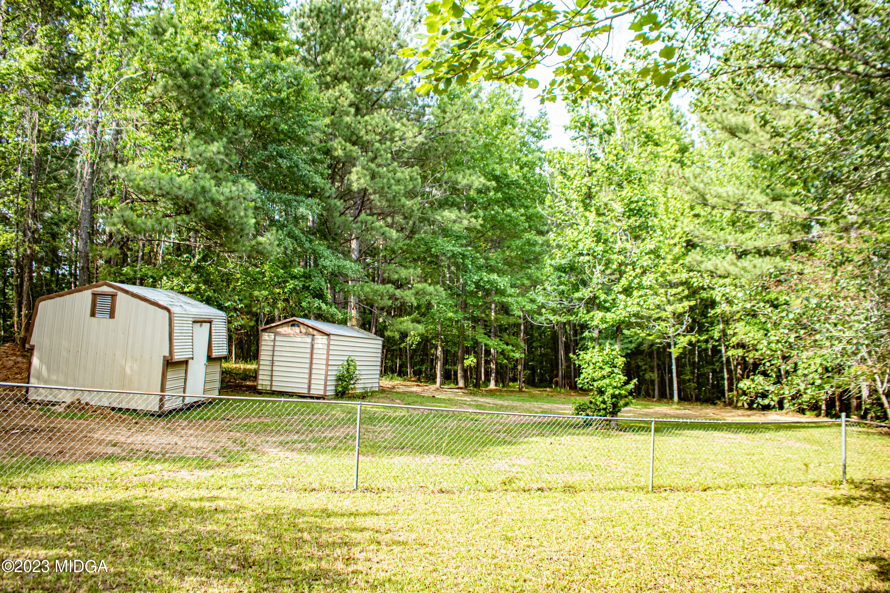 2818 Pea Ridge Road Juliette, GA 31046 - Photo 51 of 71 a view of a swimming pool with a house