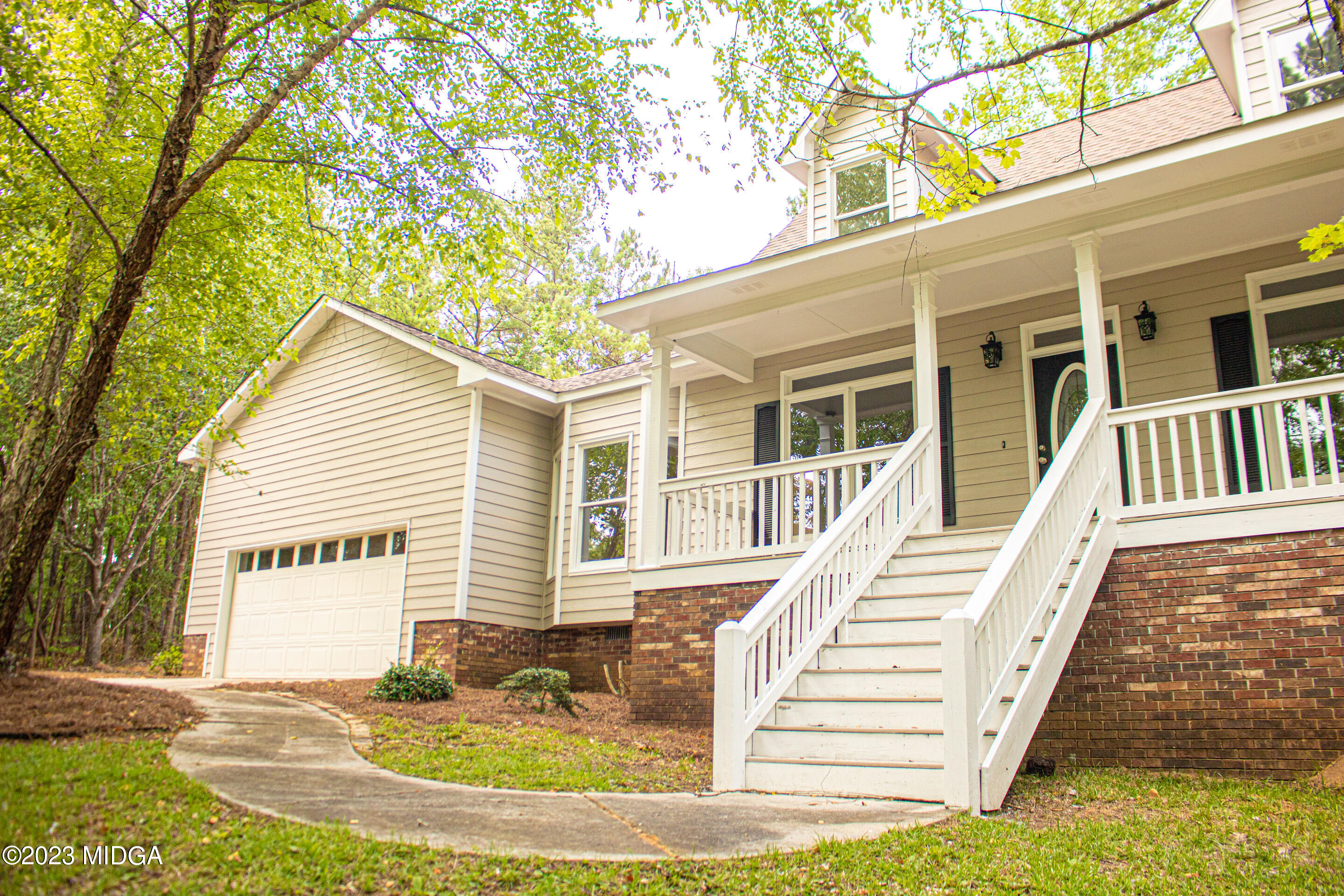 2818 Pea Ridge Road Juliette, GA 31046 - Photo 10 of 71 a view of a house with a small yard and wooden fence