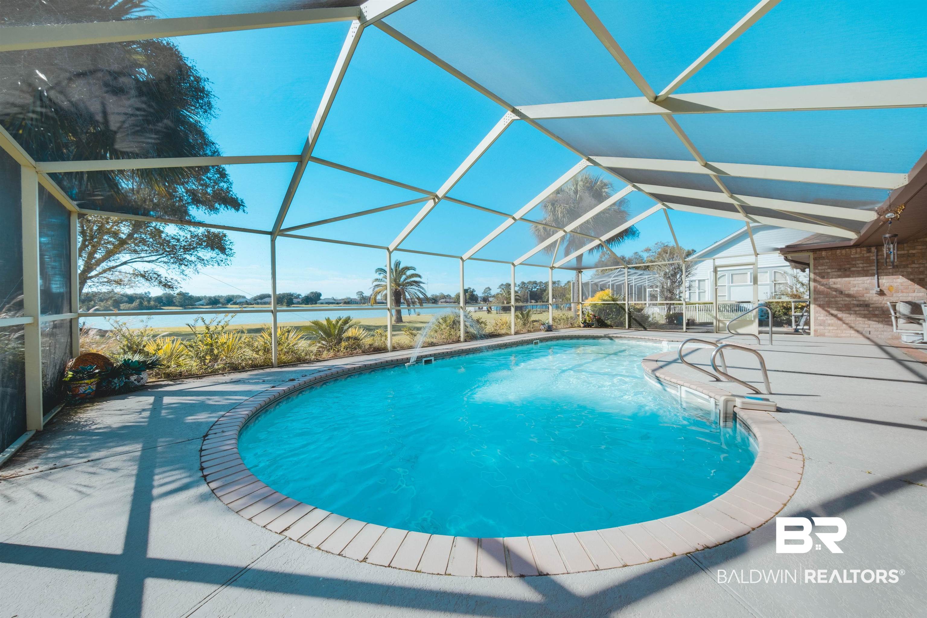 9462 Lakeview Drive Foley, AL 36535 - Photo 45 of 50 View of swimming pool with a patio area, a water view