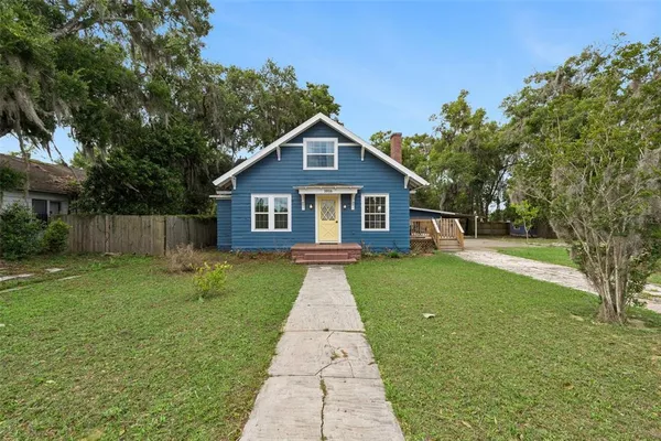 a front view of a house with yard