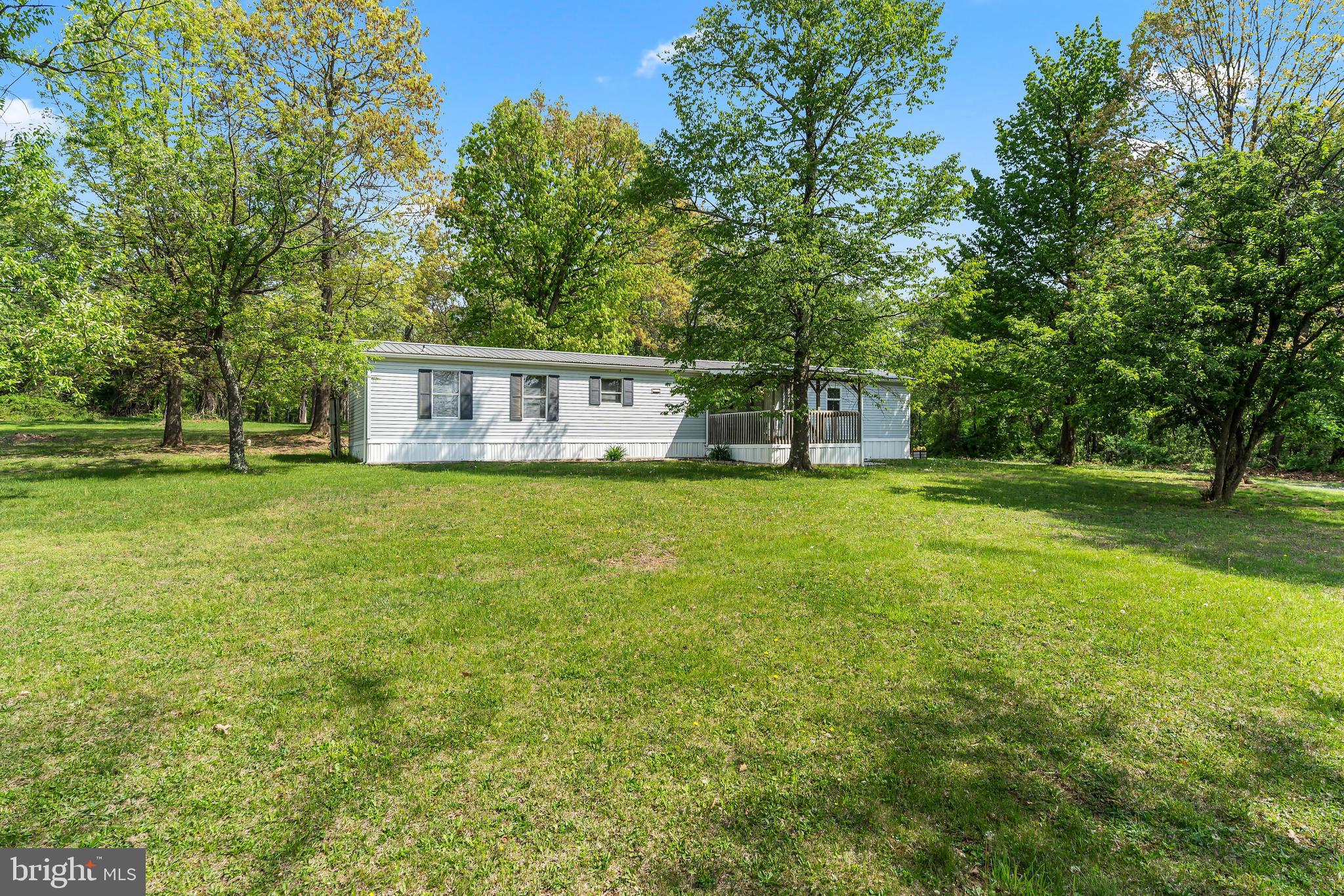 a view of house with backyard