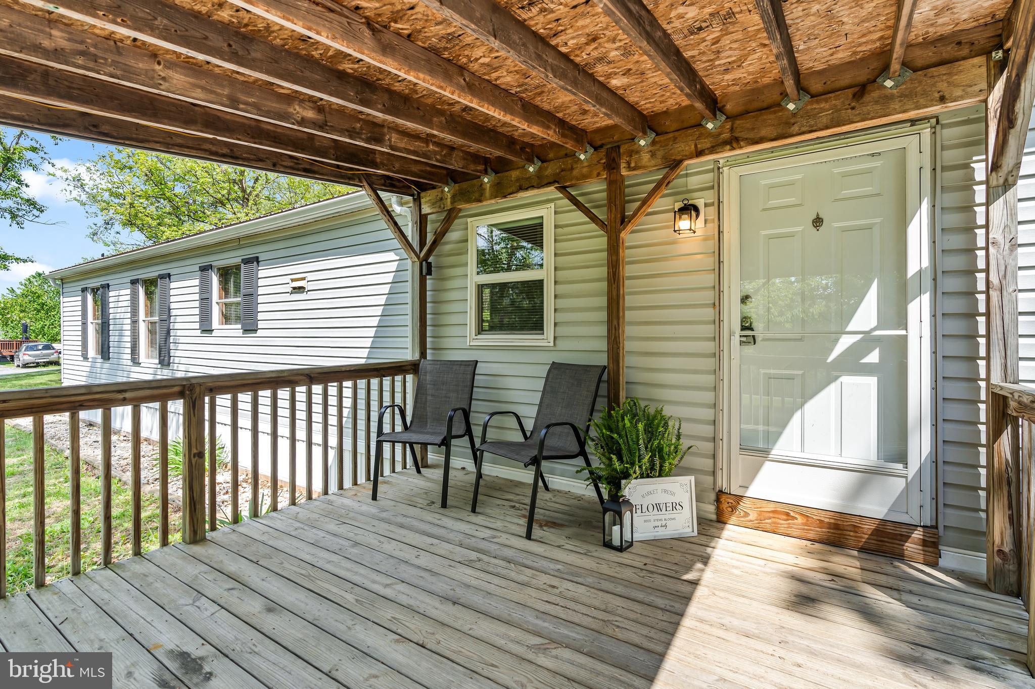 1217 Nestle Quarry Road Falling Waters, WV 25419 - Photo 15 of 52 a view of outdoor space with deck and furniture