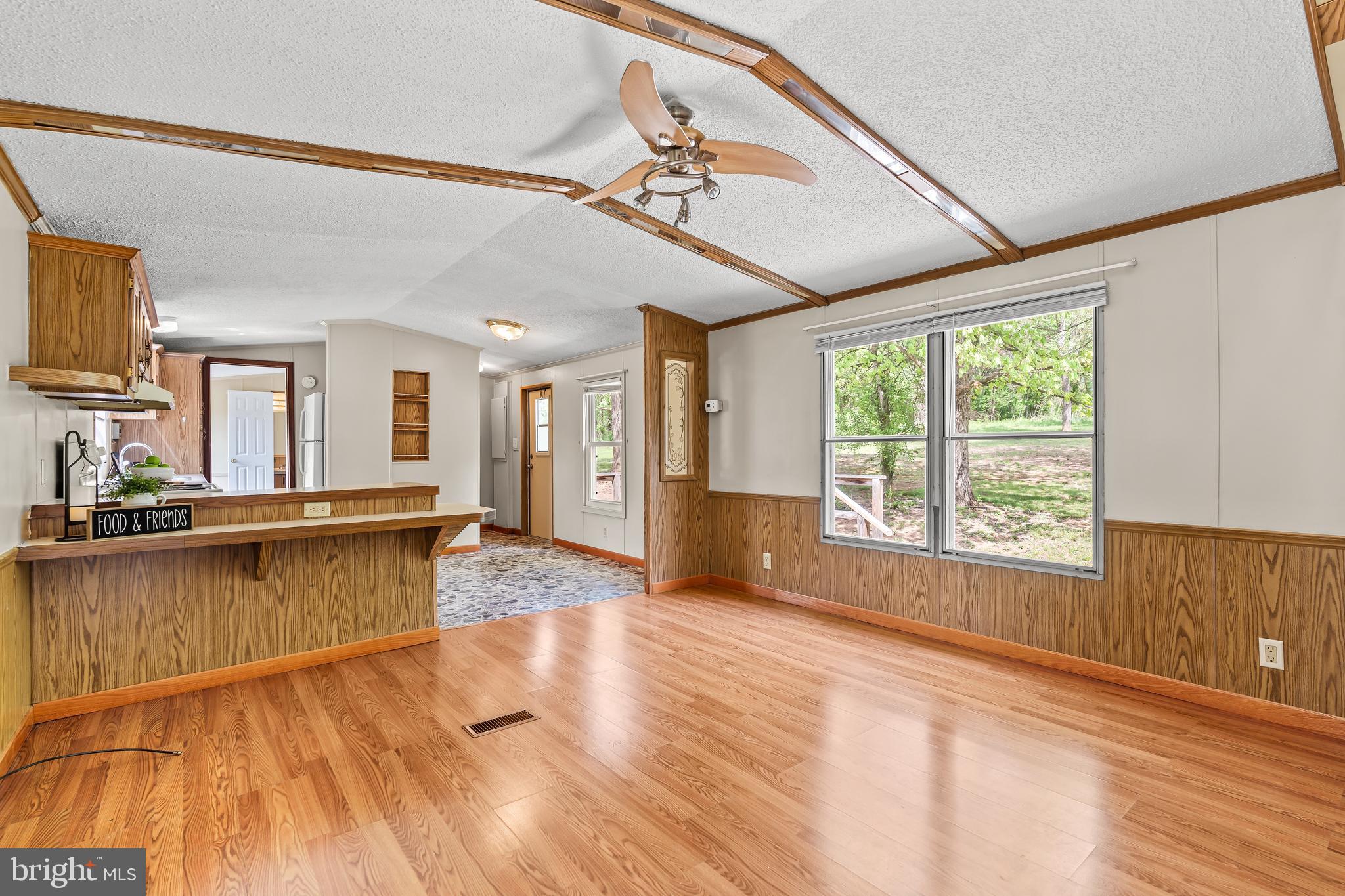 1217 Nestle Quarry Road Falling Waters, WV 25419 - Photo 17 of 52 a large hall with stainless steel appliances granite countertop a large window