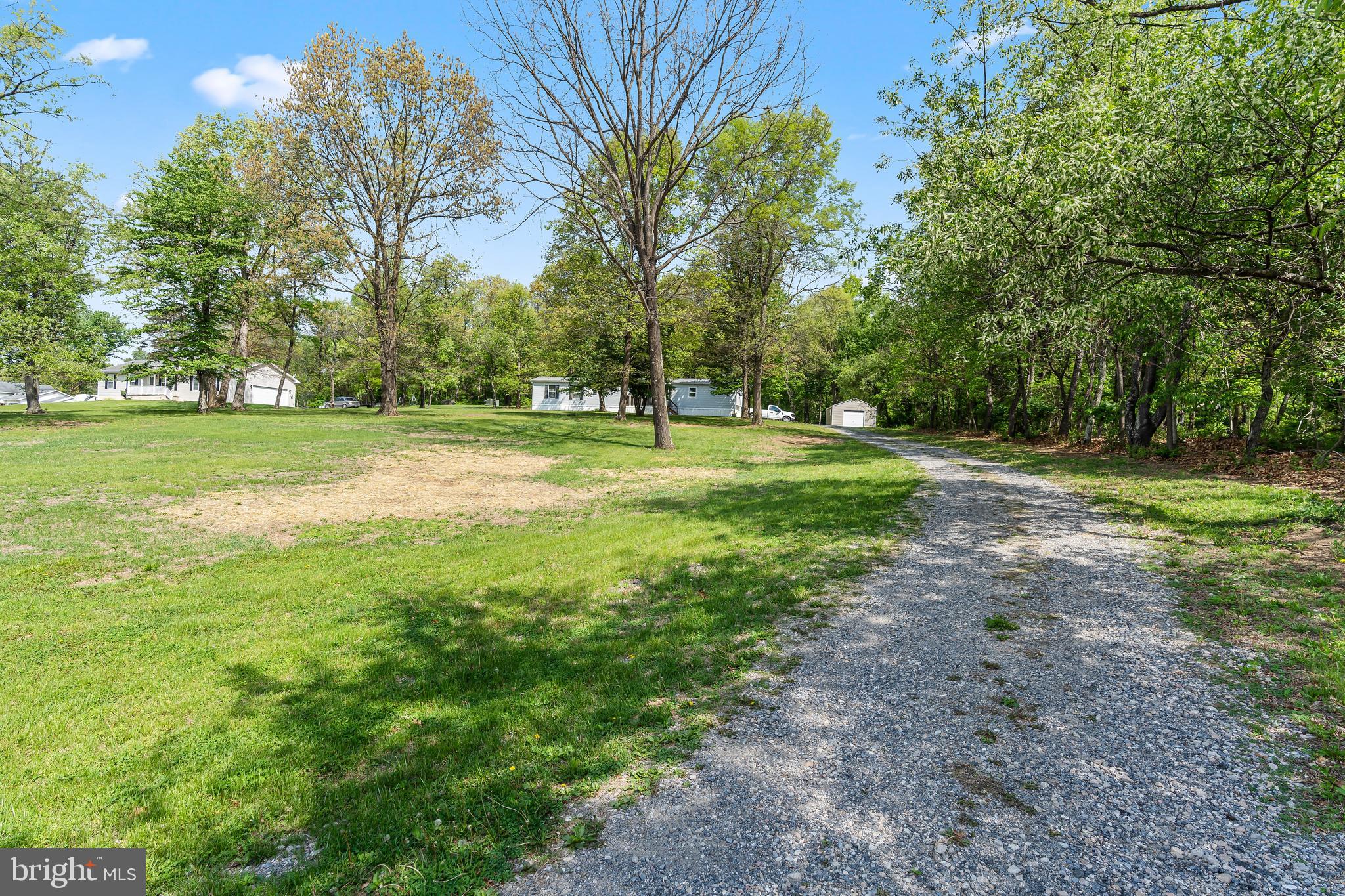 1217 Nestle Quarry Road Falling Waters, WV 25419 - Photo 2 of 52 a view of a big yard with trees