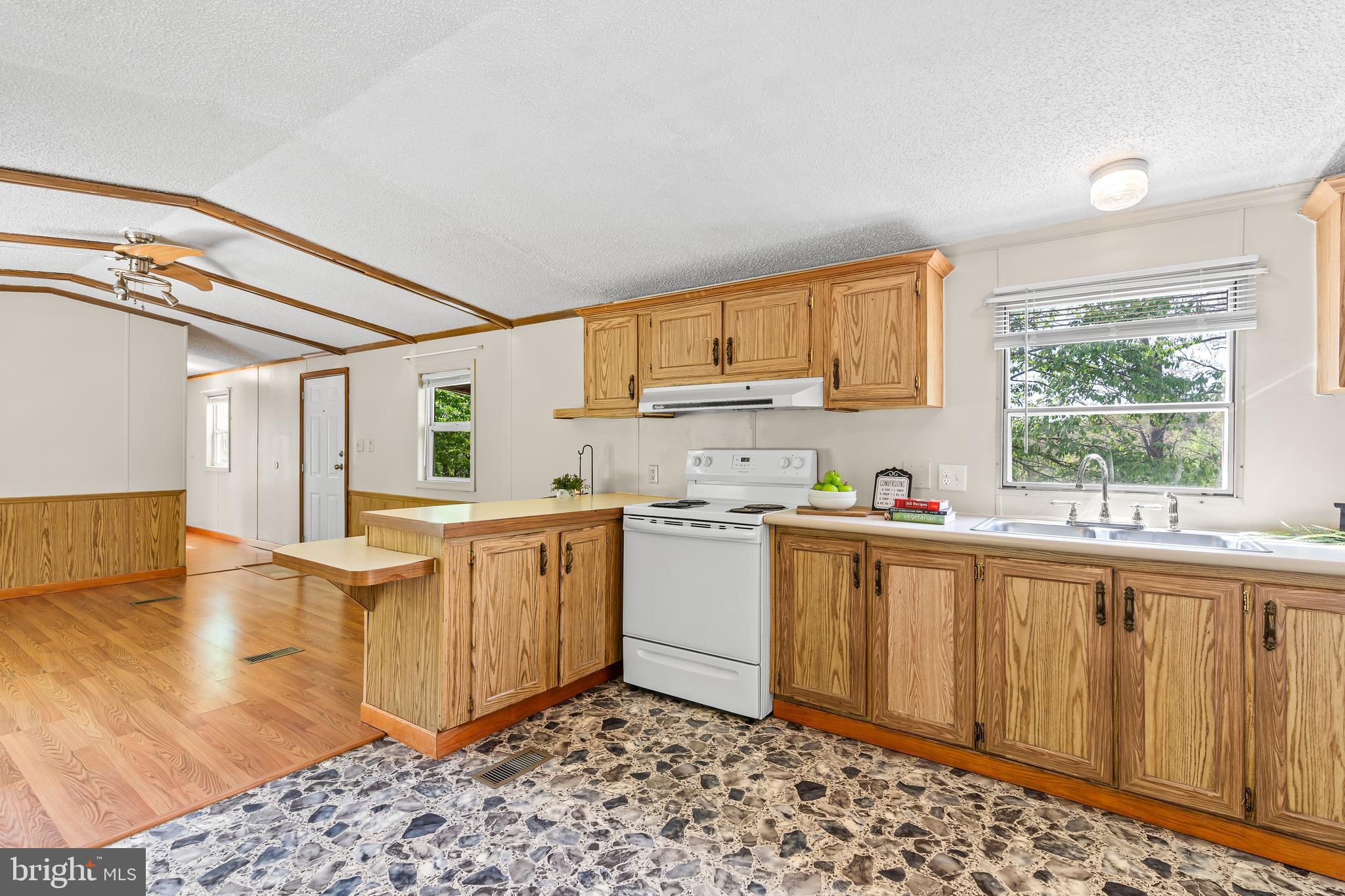 1217 Nestle Quarry Road Falling Waters, WV 25419 - Photo 23 of 52 a kitchen with a sink cabinets and window